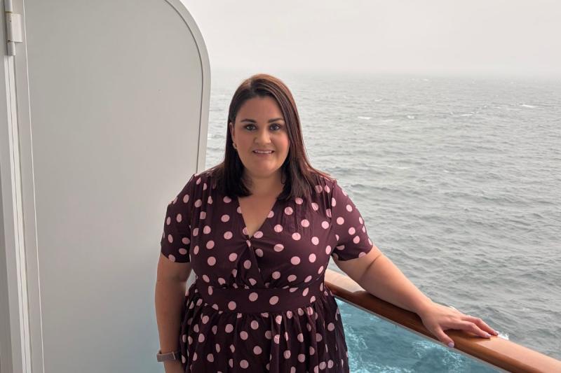 Woman smiling on cruise balcony