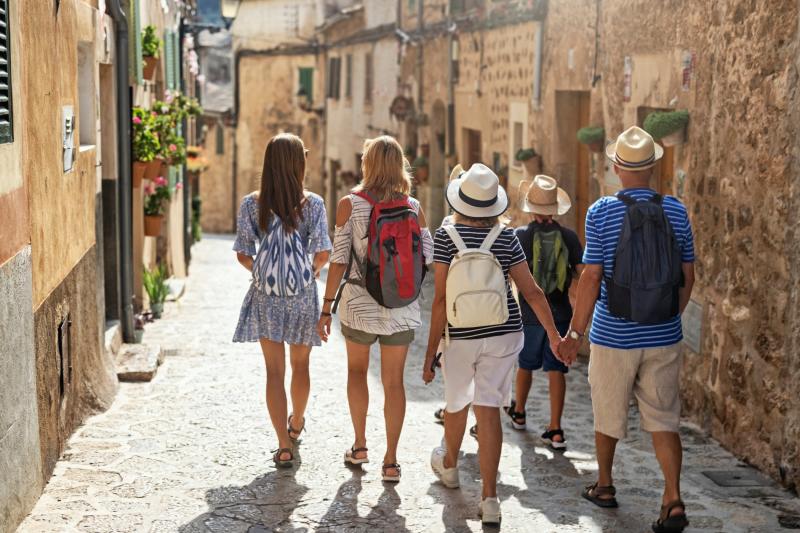 A multi-generational group walk through Valldemossa in Majorca
