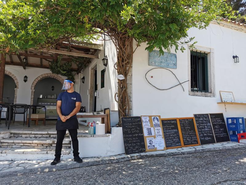 Kouloura taverna's waiters wore plastic face visors