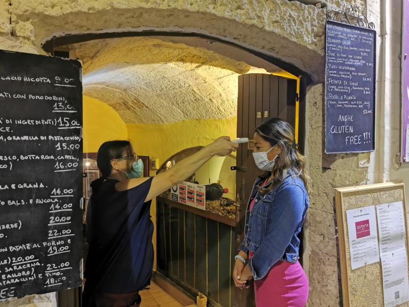 Temperature checks are carried out before entering osterias and hotels