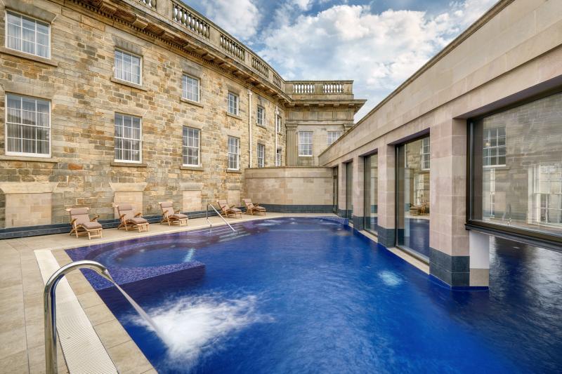 The indoor-outdoor pool features two 'jacuzzi zones'