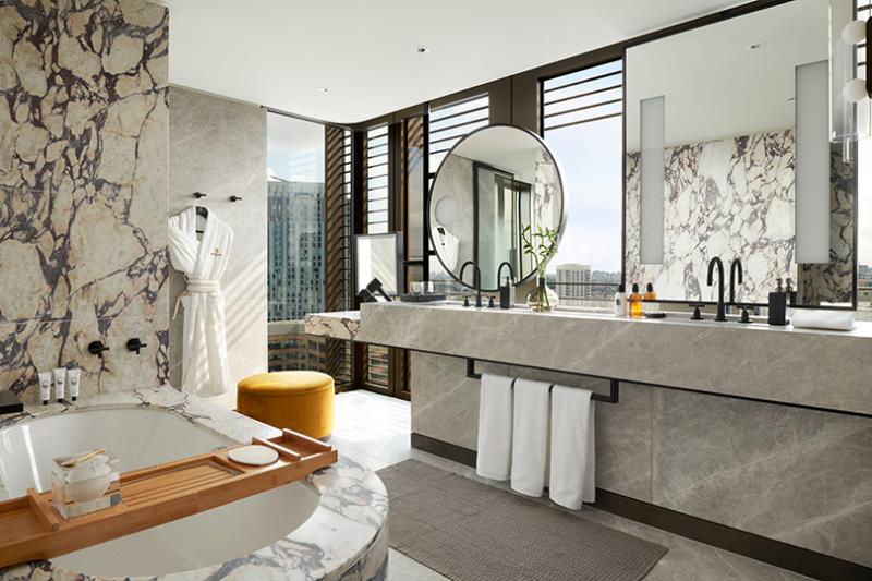 Soaking tub and Diptyque amenities are among the treats in the bathroom