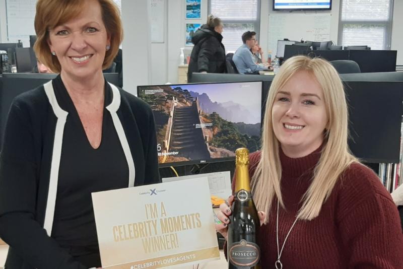 Katie Bowles from ROL Cruise (right) is rewarded by Celebrity's Ruth Gardiner