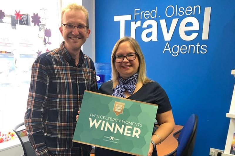 Claire Bradford of Fred Olsen Travel is visited by Celebrity's Peter Ryan after her recent Celebrity Moments win
