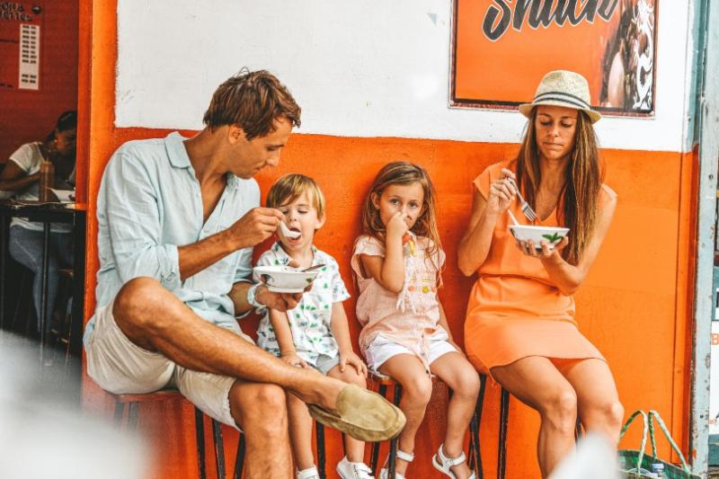 A family enjoy a street food tour with Veranda Tamarin