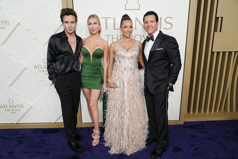 Liam Payne (left) is joined by actress and partner Kate Cassidy (second from left) and executive vice president of Atlantis Timothy Kelly (right) and guest at the event