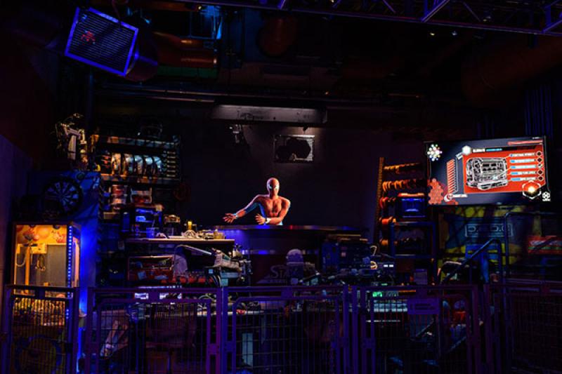 Riders help Spider-Man catch runaway bots in the Spider-Man W.E.B. Adventure attraction