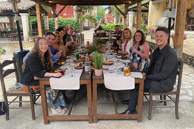 TTG's Madeleine Barber and Grecotel's Konstantinos Sinis with the six agents at Danilia Village
