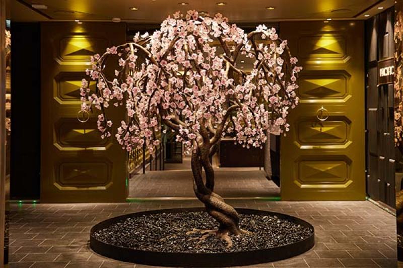 A bonsai cherry tree sculpture greets guests at Pacific Rim