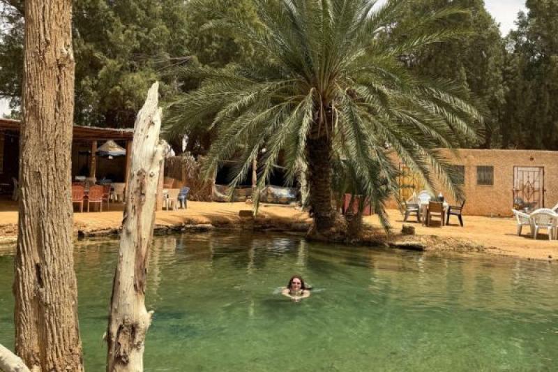  Claire enjoys a refreshing dip in Ksar Ghilane in Tunisia