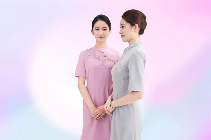 Passengers are welcomed onboard by the Juneyao Air team