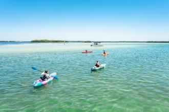 Kayaking on clear blue ocean water