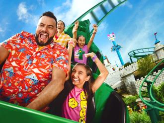 A father and child riding a rollercoaster